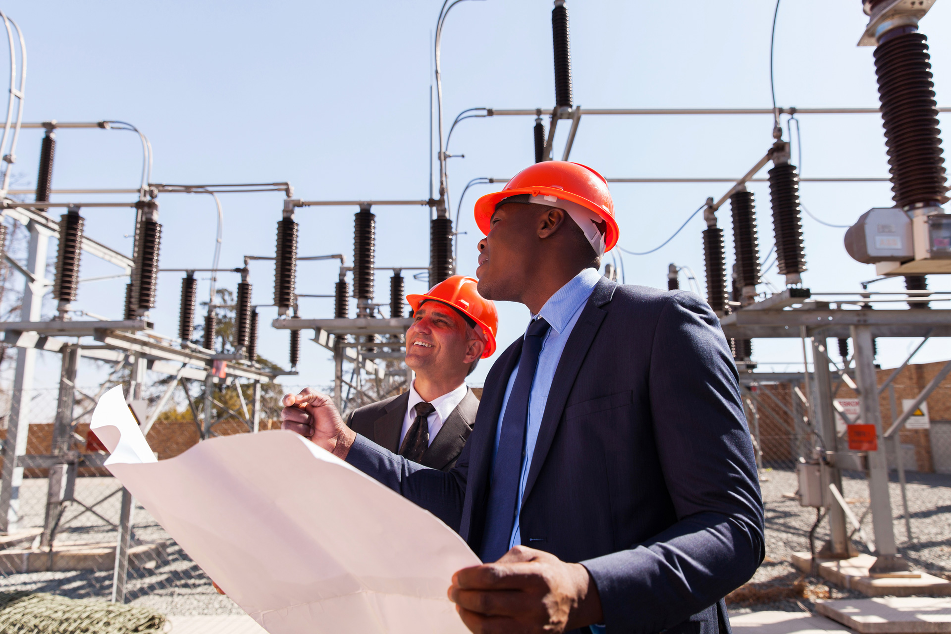 industrial managers working in electric substation
